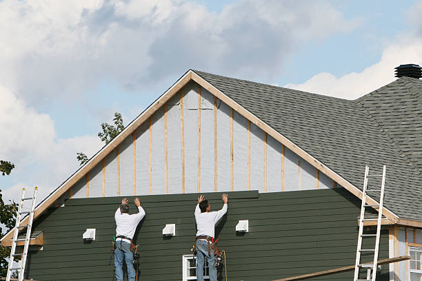 Professional Storm Damage Siding Repair technician working in Oxford, MD